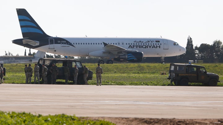 The airliner's engines were left running after it landed in Malta 