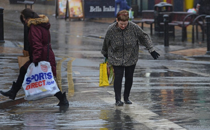 <strong>Shoppers in Blackpool, Lancs, were spotted wading through huge puddles in the town centre</strong>