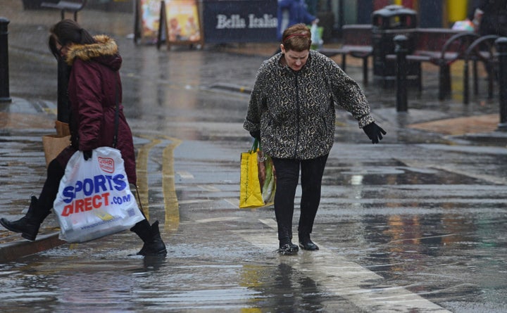 Shoppers in Blackpool, Lancs, were spotted wading through huge puddles in the town centre