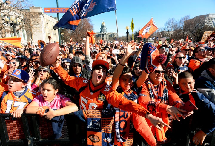 Fans cheer as Peyton Manning is introduced onstage during the Denver Broncos Super Bowl 50 victory rally in Civic Center Park, Feb. 9, 2016, in Denver.