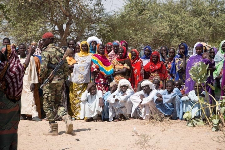 Chadian armed soldiers supervise aid distributions in the Lake Chad Basin.