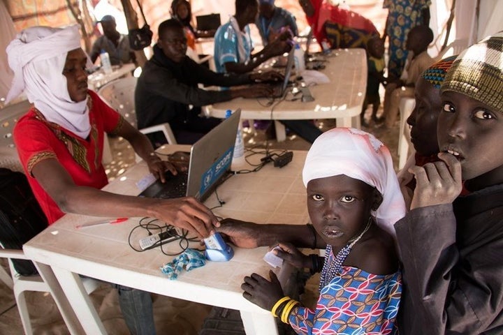 Displaced families await fingerprinting and digital registration meant to keep track of the total numbers.