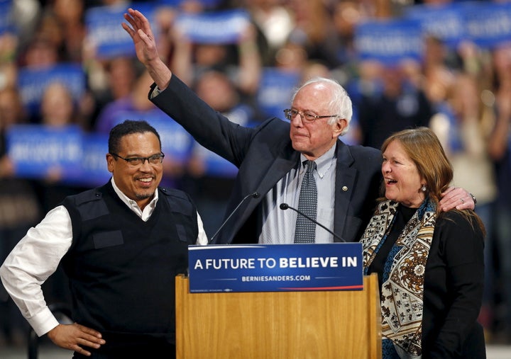 Bernie Sanders (C) stands on stage with his wife, Jane O'Meara Sanders (R), and U.S. Rep. Keith Ellison on Jan. 26, 2016.