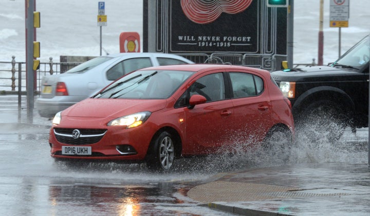 A car makes a big splash as big puddles are formed in Blackpool, Lancs., due to heavy rain and high winds hitting the coastal Lancashire city.