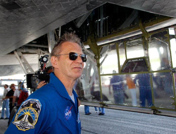 Piers Sellers, who was born in England, of the space shuttle Atlantis, looks at the orbiter after landing at the Kennedy Space Centre in Cape Canaveral, Florida May 26, 2010