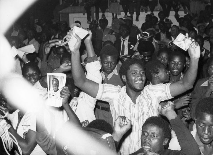 Residents of Salisbury cheer during the proclamation of independence for the nation of Zimbabwe in April 1980.