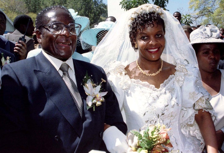 Mugabe and new wife Grace leave the Kutama Catholic Church on Aug. 17, 1996. The recent crisis arose as his hoped to extend political power to his wife as a possible successor.