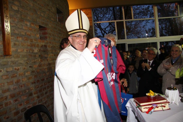 In 2011, Francis — then known as Cardinal Jorge Mario Bergoglio — holds a jersey from the San Lorenzo soccer club, of which he was known to be a fan.