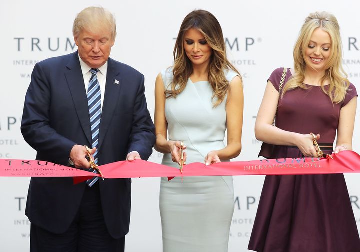 President-elect Donald Trump, Melania Trump and his daughter Tiffany Trump cut the ribbon at the new Trump International Hotel in Washington, DC, on Oct. 26.
