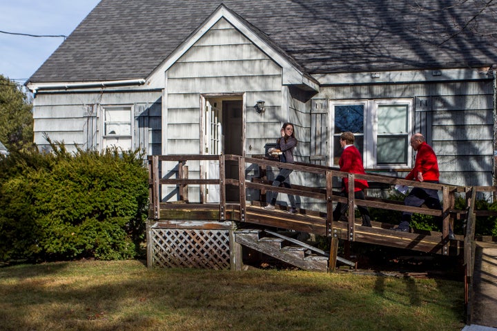 Volunteers in Maine delivering a meal through the Meals on Wheels program.