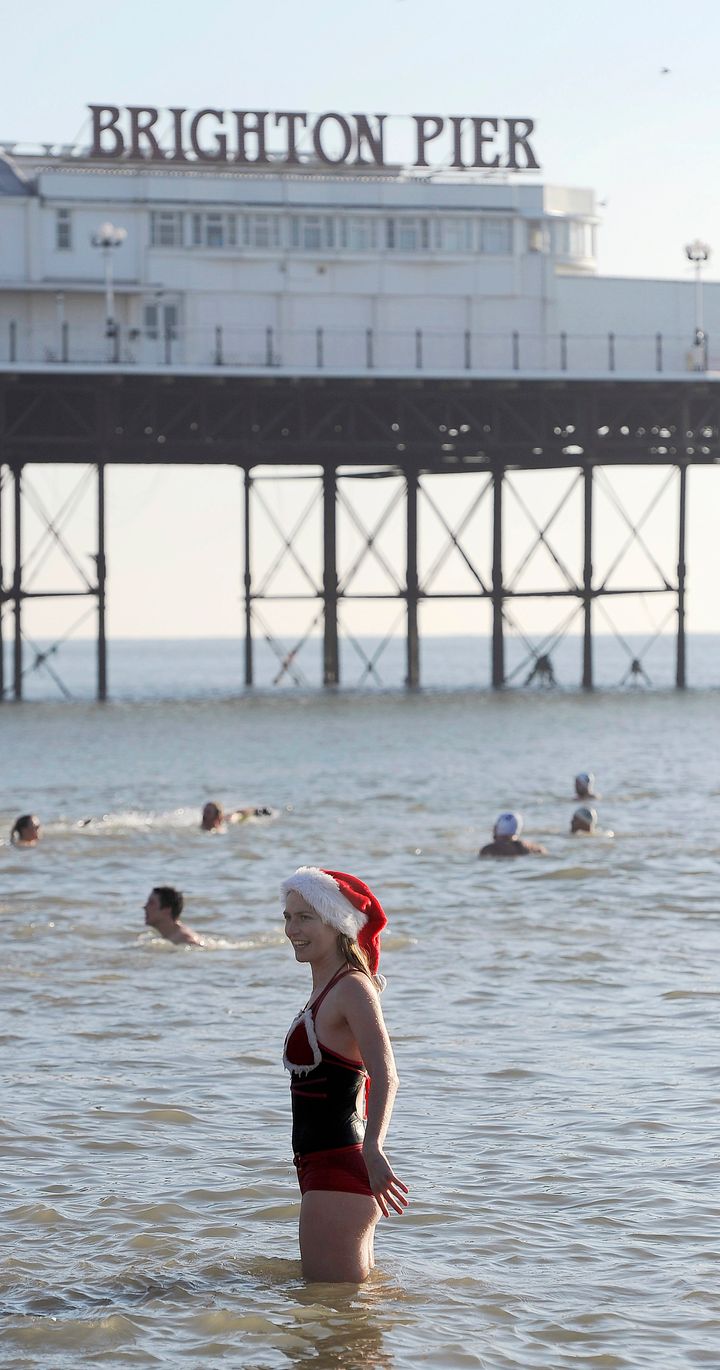 <strong>A swimmer takes to the sea for a Christmas Day dip on Brighton Beach in 2010</strong>