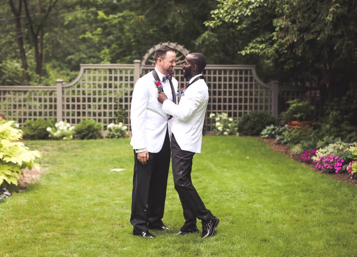 <p>Eric and David share a moment before their wedding reception. </p>