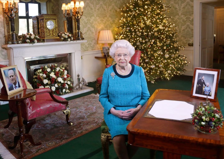 Queen Elizabeth II sits at a desk in the Regency Room in Buckingham Palace, London, after recording her Christmas Day broadcast to the Commonwealth.