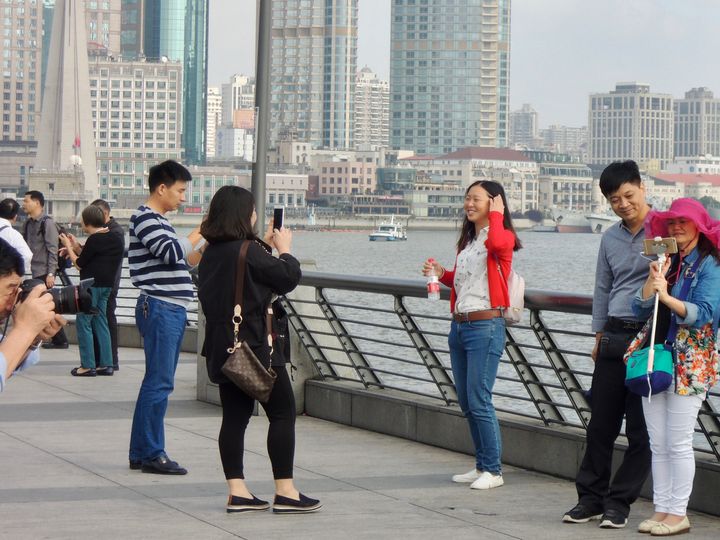 Everyone is a photographer, model or both on The Bund.