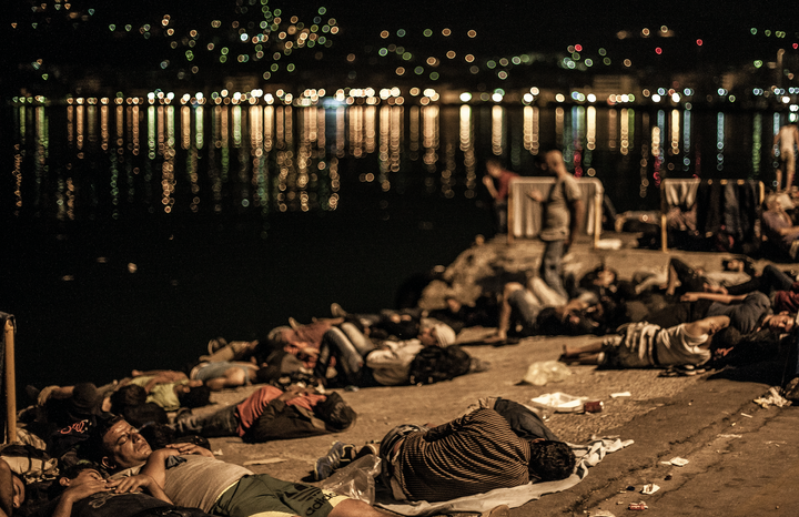 Refugees and migrants sleep outdoors on the shores of Lesbos, Greece.