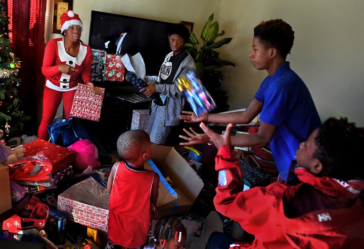 Tyshika Britten tosses gifts to her 15-year-old son Vashon Bolden. Donations and presents came in from people around the coun