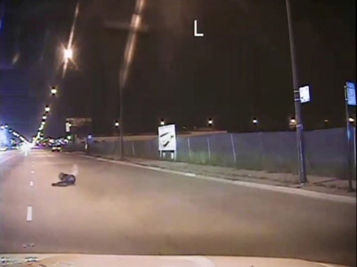 Laquan McDonald lies on a road after being shot by police officer Jason Van Dyke in Chicago, in this still image taken from a
