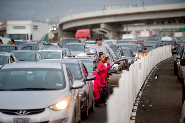 Motorists exit their vehicles as protesters block traffic on the San Francisco-Oakland Bay Bridge on Monday, Jan. 18, 2016, in San Francisco. A group of protesters from the group Black Lives Matter caused the shutdown of one side of the bridge in a police-brutality protest tied to the Rev. Martin Luther King Jr. holiday.