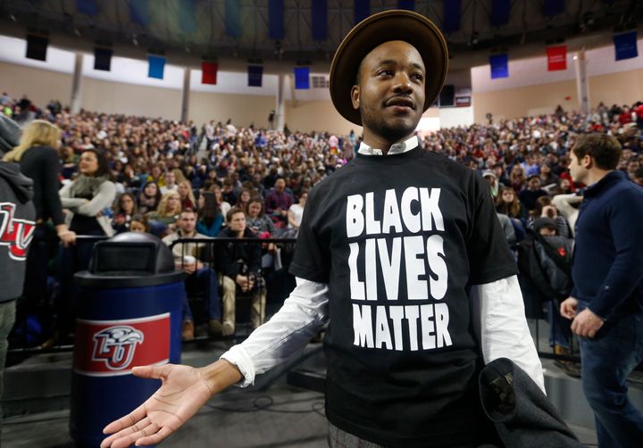 Liberty University student Jeff Long, of Washington DC., wears a Black Lives Matter t-shirt as he looks for a seat prior to a speech by Republican Presidential candidate Donald Trump at Liberty University in Lynchburg, Va., Monday, Jan. 18, 2016.