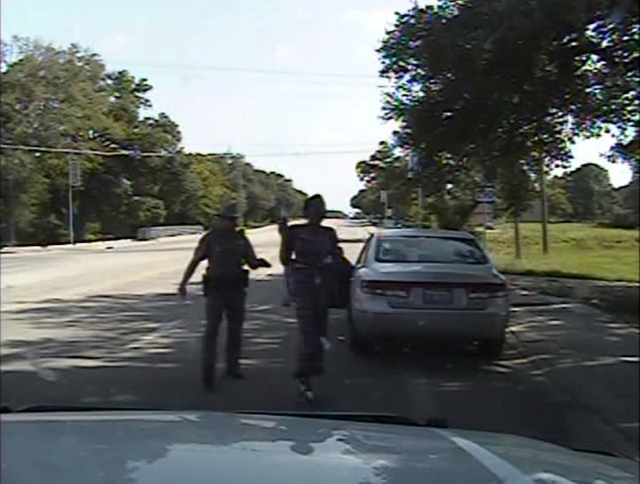 Texas state trooper Brian Encinia points a Taser as he orders Sandra Bland out of her vehicle, in this still image captured from the police dash camera video from the traffic stop of Bland's vehicle in Prairie View, Texas, U.S. on July 10, 2015.