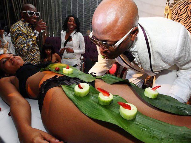 South African tycoon and socialite Kenny Kunene eating sushi from a model’s naked body during one of his lavish birthday parties in Johannesburg.