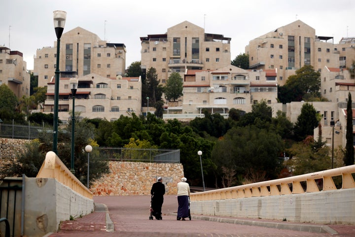 A couple walk in the Israeli settlement of Maale Edumim.