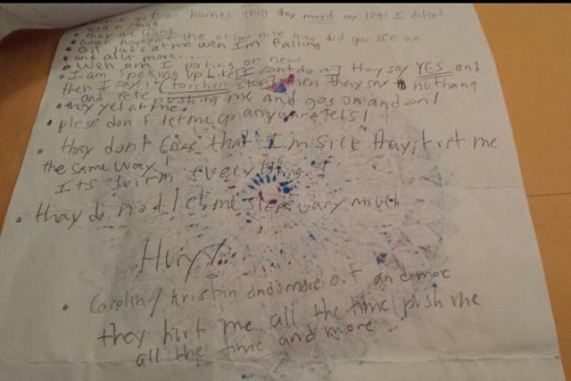 <p>One of the handwritten notes Justina snuck to her family </p>
