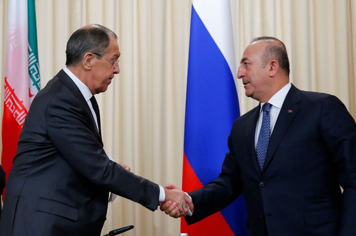 Foreign ministers, Sergei Lavrov, left, of Russia, and Mevlut Cavusoglu, right, of Turkey have reportedly agreed on a proposal for a ceasefire in Syria.