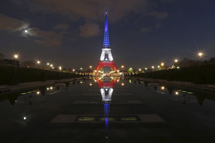 The Eiffel Tower lit with the blue, white and red colors of the French flag on Nov. 23, 2015, a week after a series of deadly attacks in Paris.