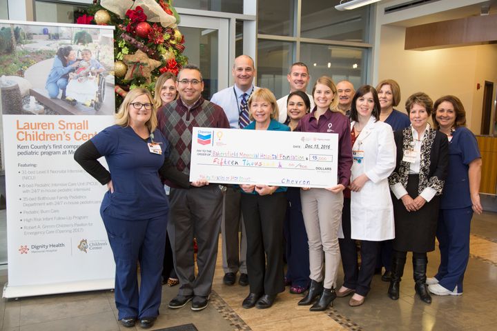 Adam Alvidrez presents a check to Bakersfield Memorial Hospital Foundation in support of “Miracles on 34th Street Mediathon”