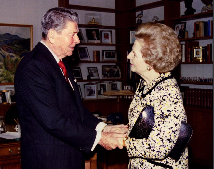 Former US President Ronald Reagan (L) greets former British Prime Minister Margaret Thatcher.