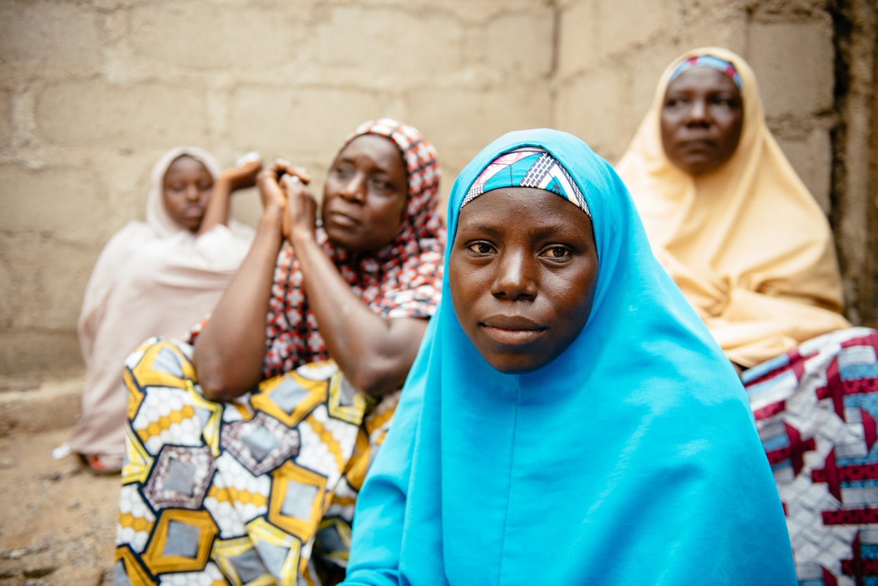 Aisha, 30, (blue hijab) in Biu, Borno State Nigeria. She and her four children were displaced 3 years ago after Boko Haram raided her village and killed her husband and two brothers.