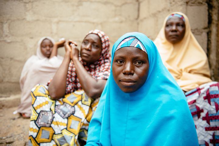 Aisha, 30, (blue hijab) in Biu, Borno State Nigeria. She and her four children were displaced 3 years ago after Boko Haram raided her village and killed her husband and two brothers.