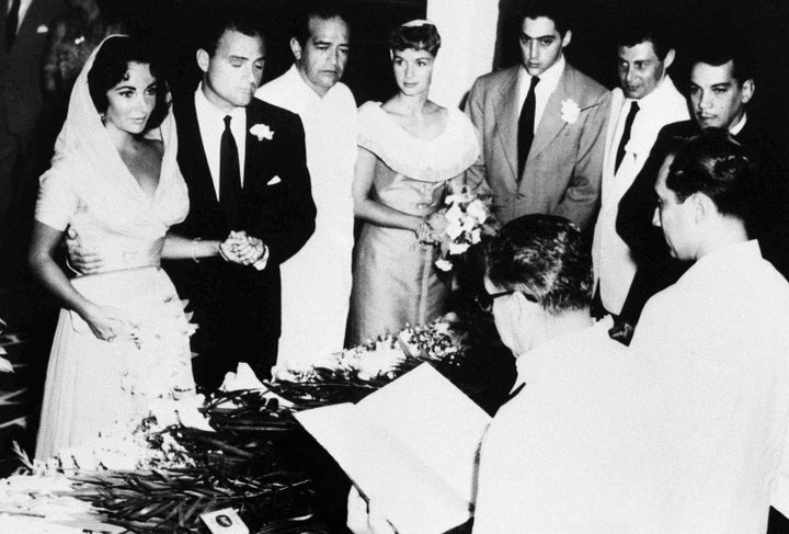 Elizabeth Taylor and Mike Todd wed at a 1957 ceremony in Mexico, with Debbie Reynolds and Eddie Fisher looking on.