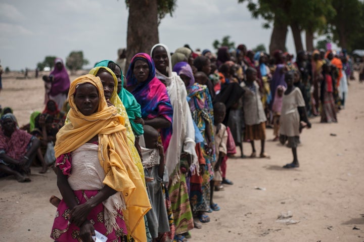 Women and children in the Muna informal settlement for internally displaced people on the outskirts of Maiduguri, Borno