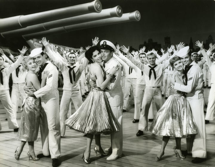 Publicity still of American actors, foreground from left, Jane Powell and Vic Damone, Ann Miller and Tony Martin, and Debbie Reynolds and Russ Tamblyn, along with dozens of others, for "Hit the Deck" (directed by Roy Rowland), 1955.