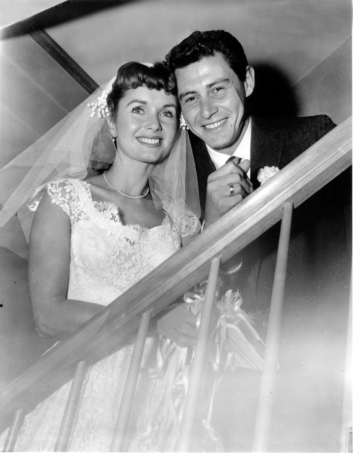 Debbie Reynolds and Eddie Fisher pose after their 1955 marriage ceremony in New York.