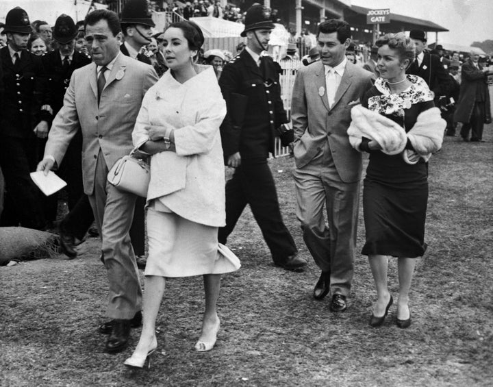 Mike Todd, Elizabeth Taylor, Eddie Fisher and Debbie Reynolds stroll through Epsom Downs on June 5, 1957.