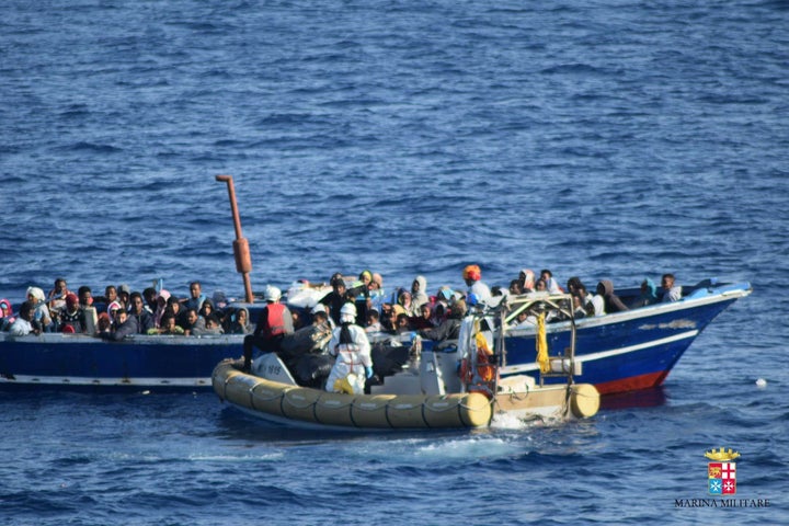 138 Refugees, trying to pass Europe, are seen on a boat at the middle of the Mediterranean Sea before Italian security forces rescued them at the Mediterranean Sea in an unspecified location on May 23, 2016.