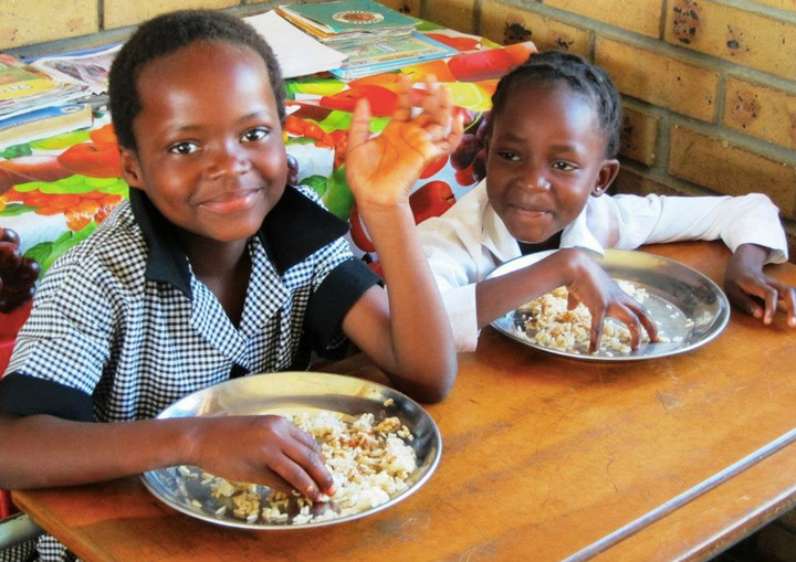 Two children served by nonprofit Seeds of Light in South Africa, which receives funds from the Satisfeito program. Satisfeito also donates to programs in Brazil and Mexico.