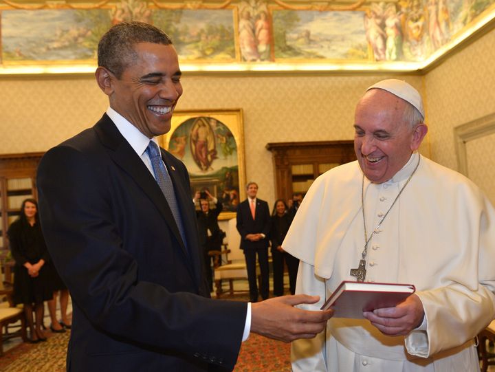 Pope Francis and President Barack Obama exchange gifts during a private audience on March 27, 2014 at the Vatican.