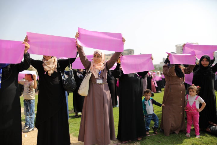 Palestinian women organize a demonstration to demand access to early screening for breast cancer in Gaza on Oct. 12, 2015.