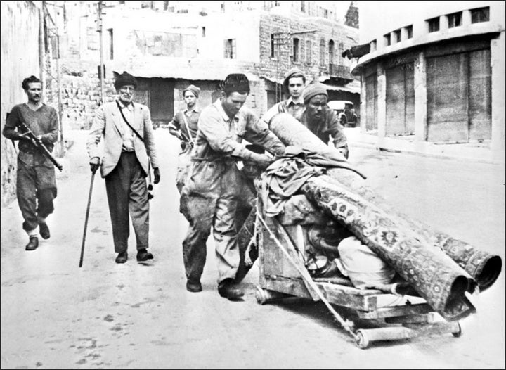 The Hagana (Zionist militia) force Palestinians out of Haifa at gunpoint in May 1948.