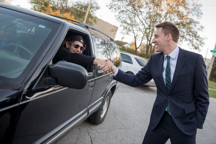 Democratic candidate for U.S. Senate in Missouri Jason Kander greets a voter on November 8, 2016 outside a polling place in Kansas City, Missouri.