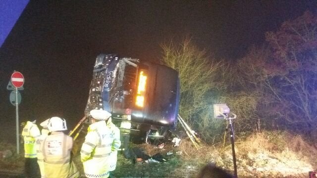 The overturned coach.