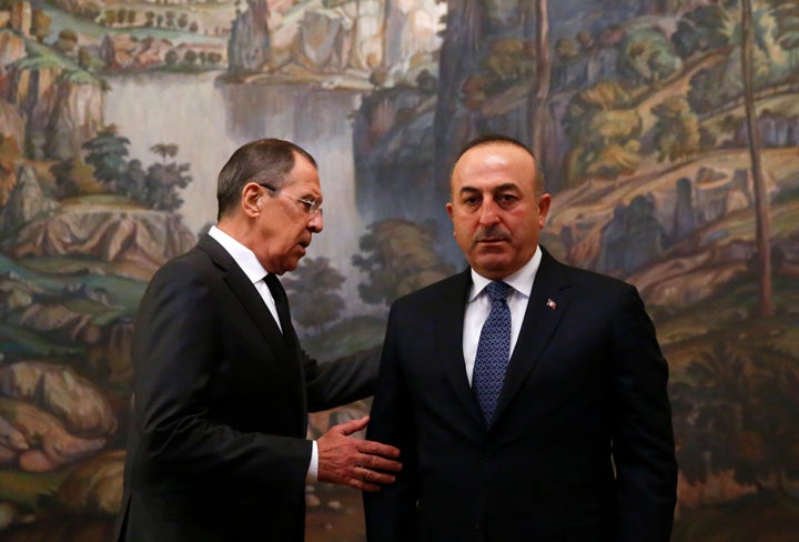 Russian Foreign Minister Sergei Lavrov, left, and his Turkish counterpart Mevlut Cavusoglu. The previous two Syria cease
