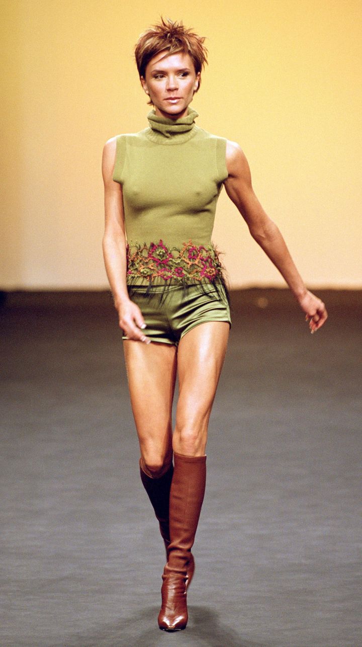 Victoria Beckham models for Maria Grachvogel during London Fashion Week in 2000