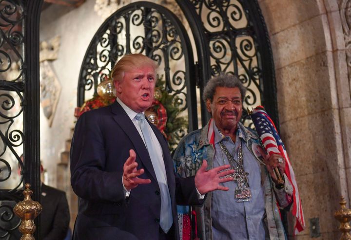 So many parties. Donald Trump stands with fight promoter Don King as they address the media during a party at Mar-a-Lago on Dec. 28.