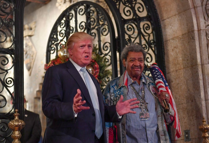 So many parties. Donald Trump stands with fight promoter Don King as they address the media during a party at Mar-a-Lago on D