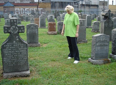  Megan Smolenyak with Annie’s unmarked plot at Calvary Cemetery, August 2006 